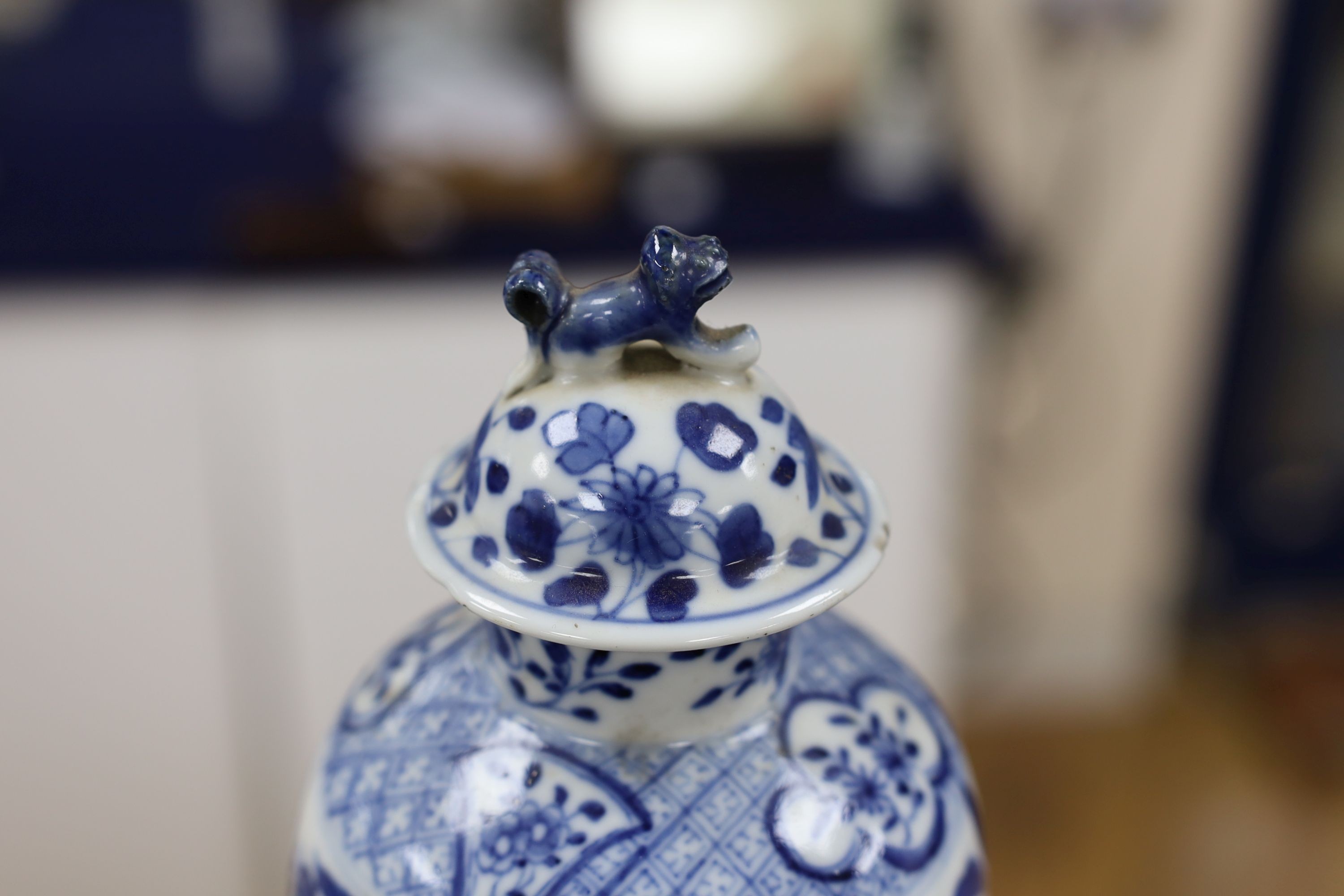 A pair of Chinese blue and white dragon vases and covers, circa 1900. 28cm